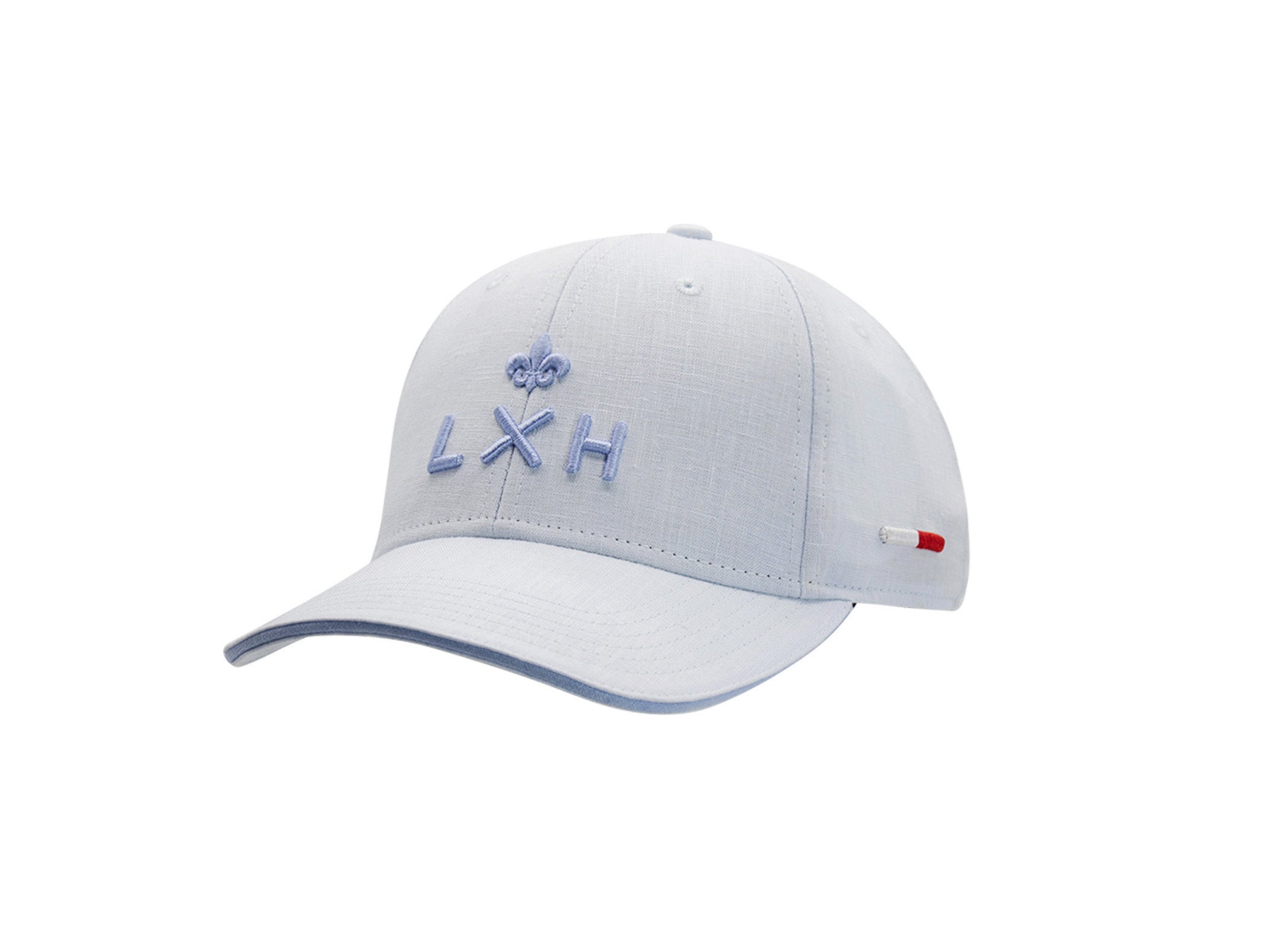 Casquette LXH x Monaco GP en lin bleu ciel vue de face, logo LXH et fleur de lys brodés ton sur ton, étiquette tricolore